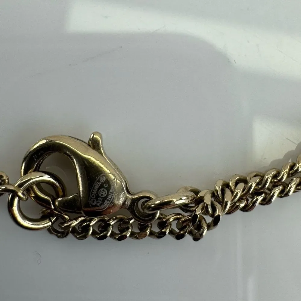 CHANEL Multi Logo Engraved Gold Crystal CC Pendant Necklace